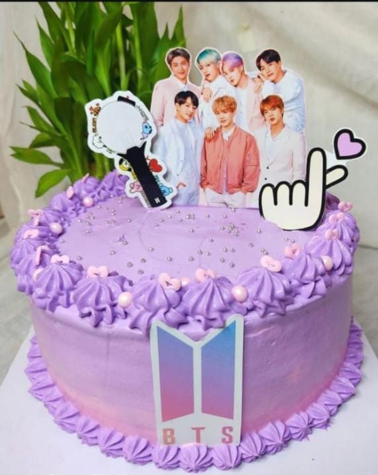 Purple K-pop themed celebration cake